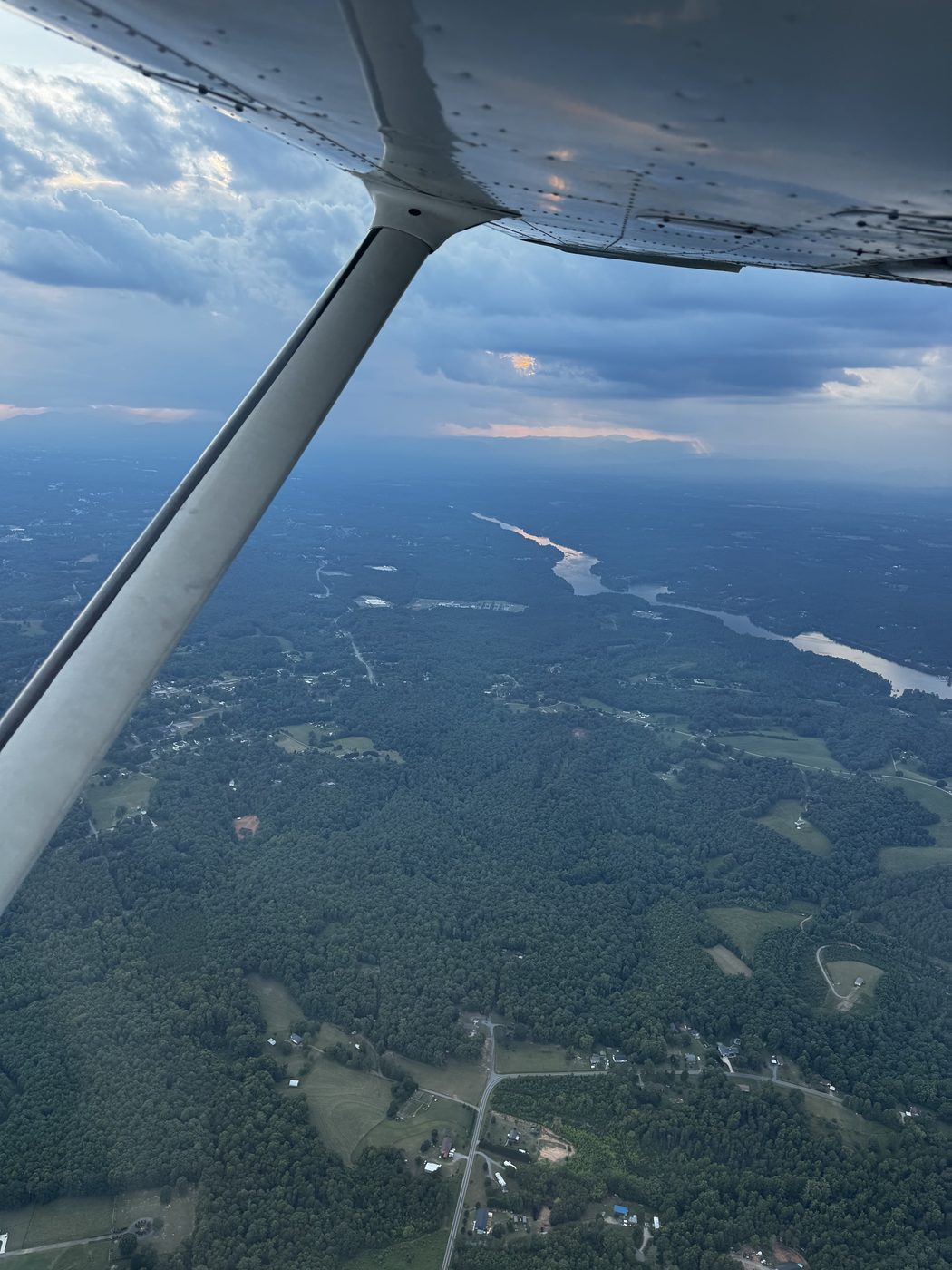 The high wing and strut out over the foothills